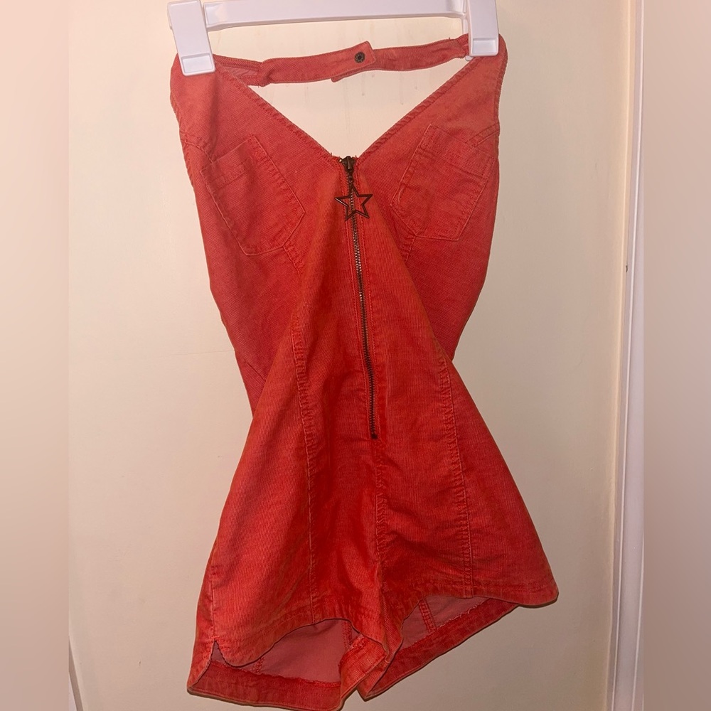 Orange romper. Never worn.